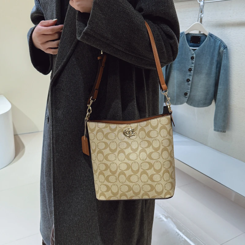 

Modern Women Bucket Bag Faux Leather Material with Drawstring Closure Inner Pocket Compact Size Ideal for Dating Daily Use