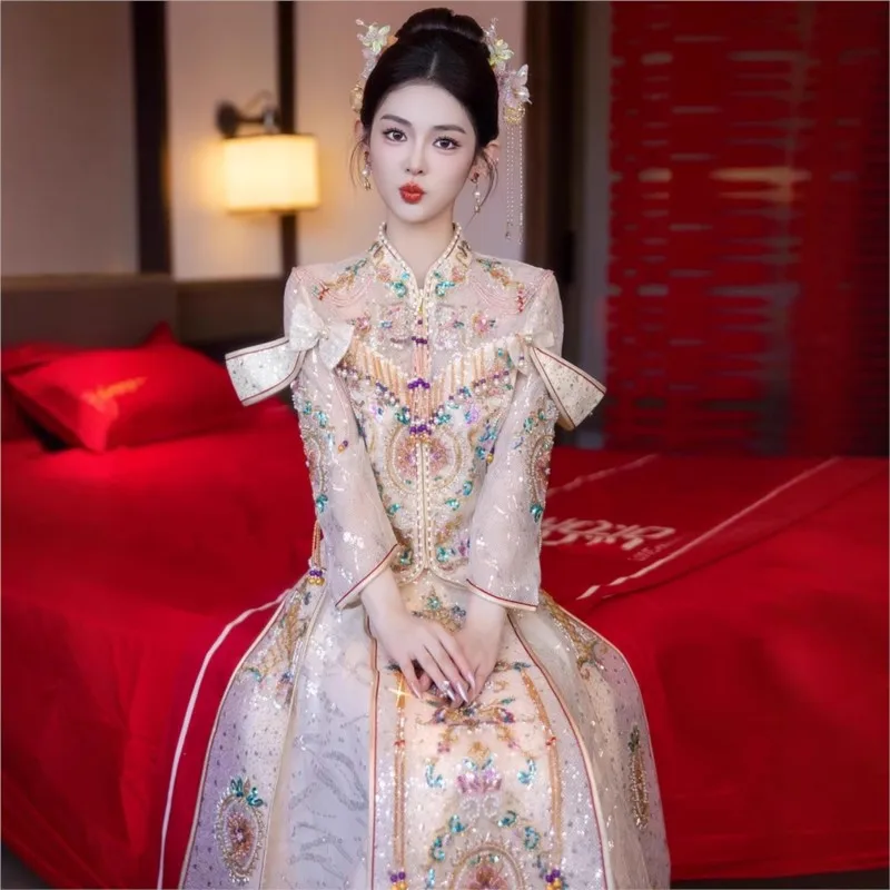 Champagne-colored Chinese-style ritual costume with an ethereal charm featuring the dragon and phoenix hexagrams