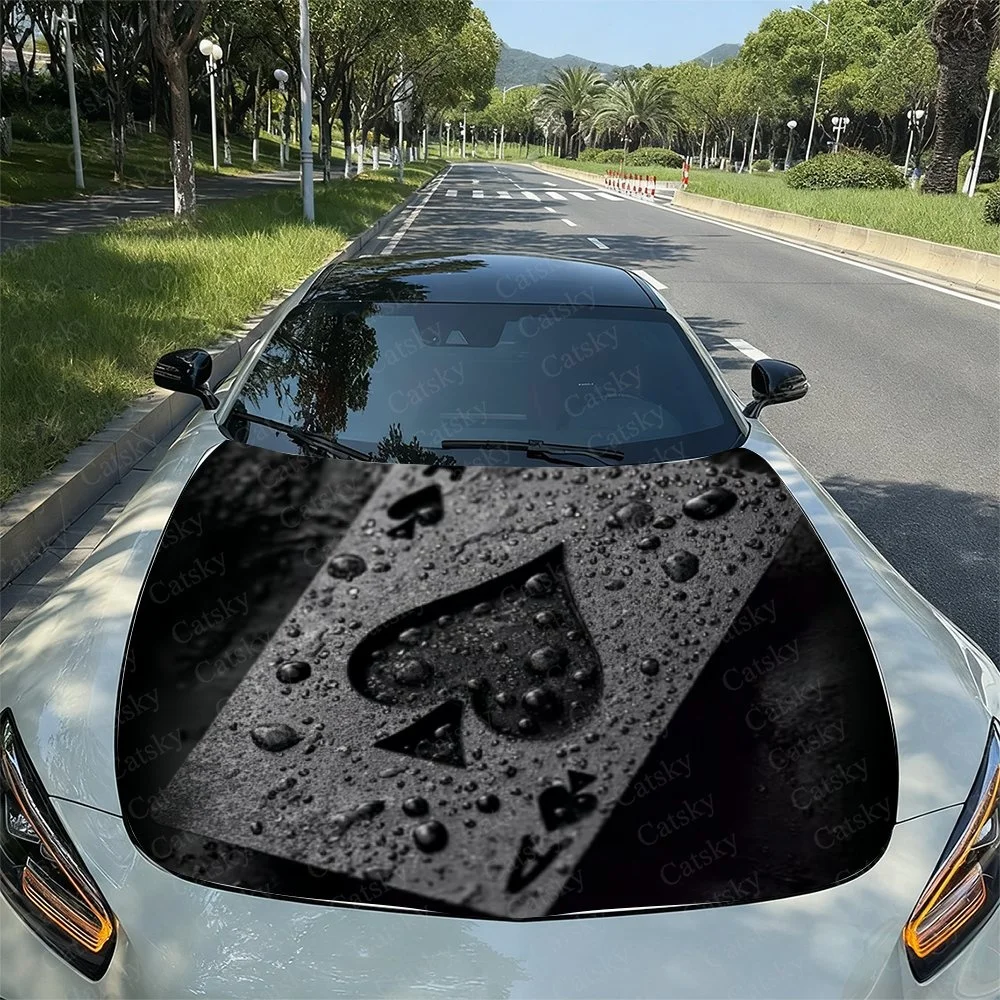 This  car features a striking black hood with a bold white spade design, enhanced by water droplets for a fresh, stylish look.Ca