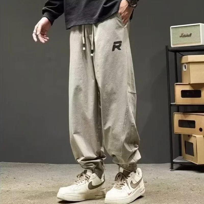 男性用レトロルーズカジュアルレギュラートレンディブランド厚手カジュアル秋冬パンツの新しいスタイルの足結び仕様