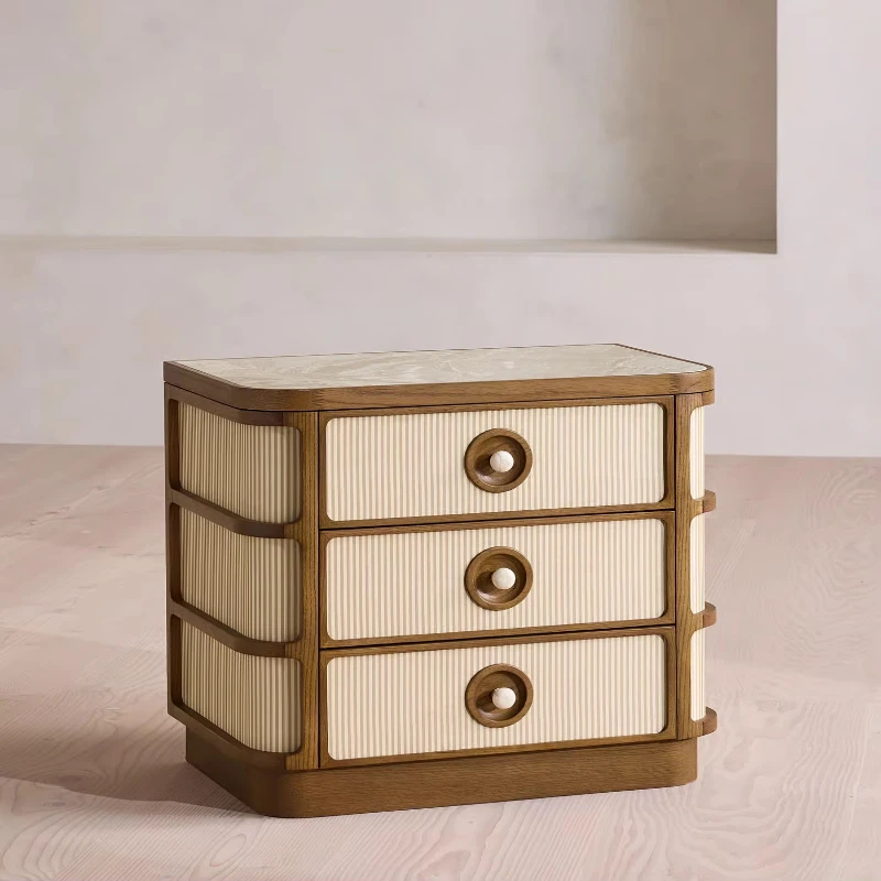High-end textured fabric and solid wood three-drawer bedside table with marble trim