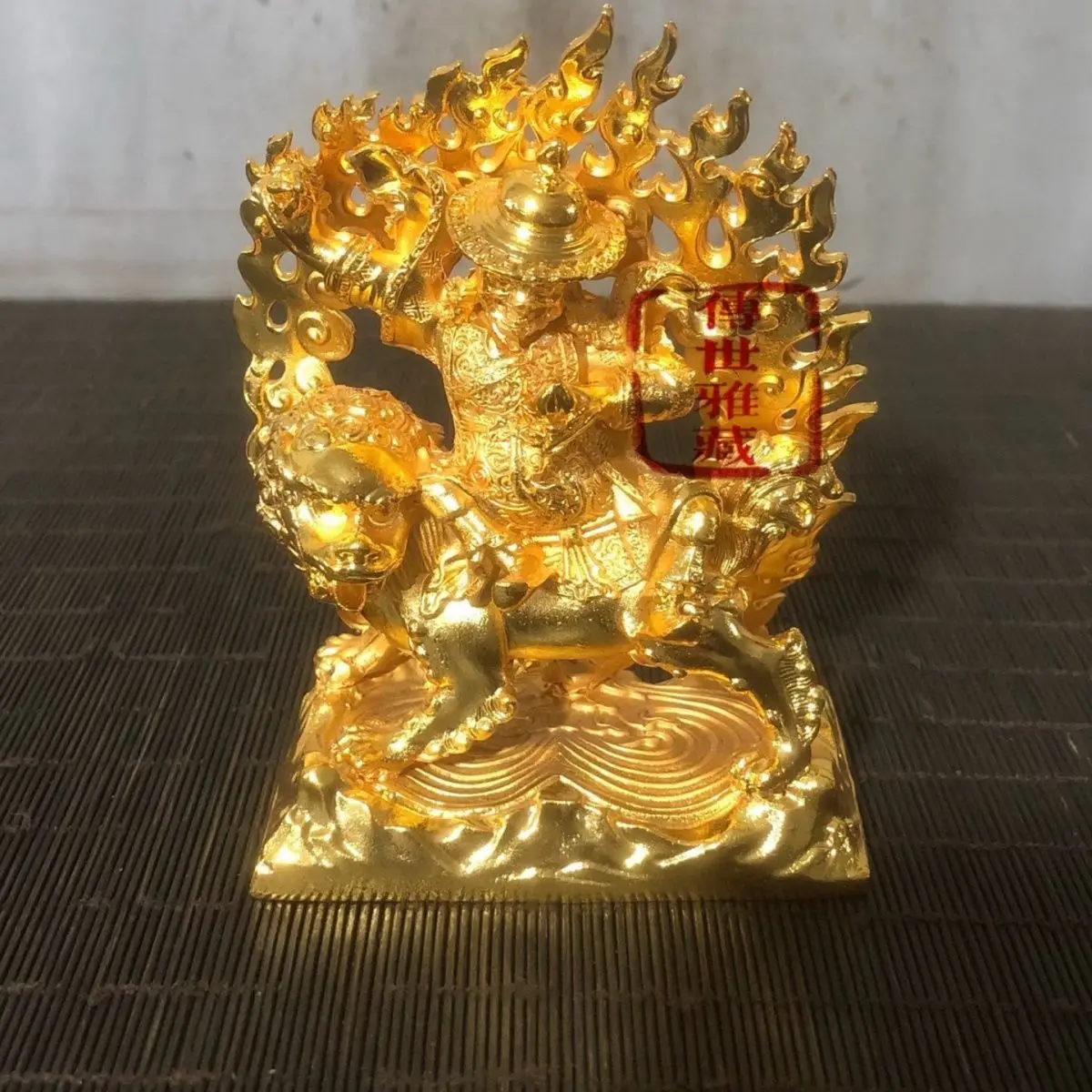 Bronze gilded statue of riding a lion and guarding the law, enshrined in Tibetan Esoteric Buddhism