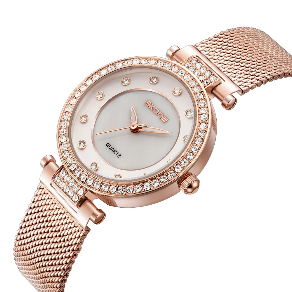 SKONE Diamond light lujo moda simple reloj de mujer correa de malla versión coreana casual temperamento reloj de cuarzo