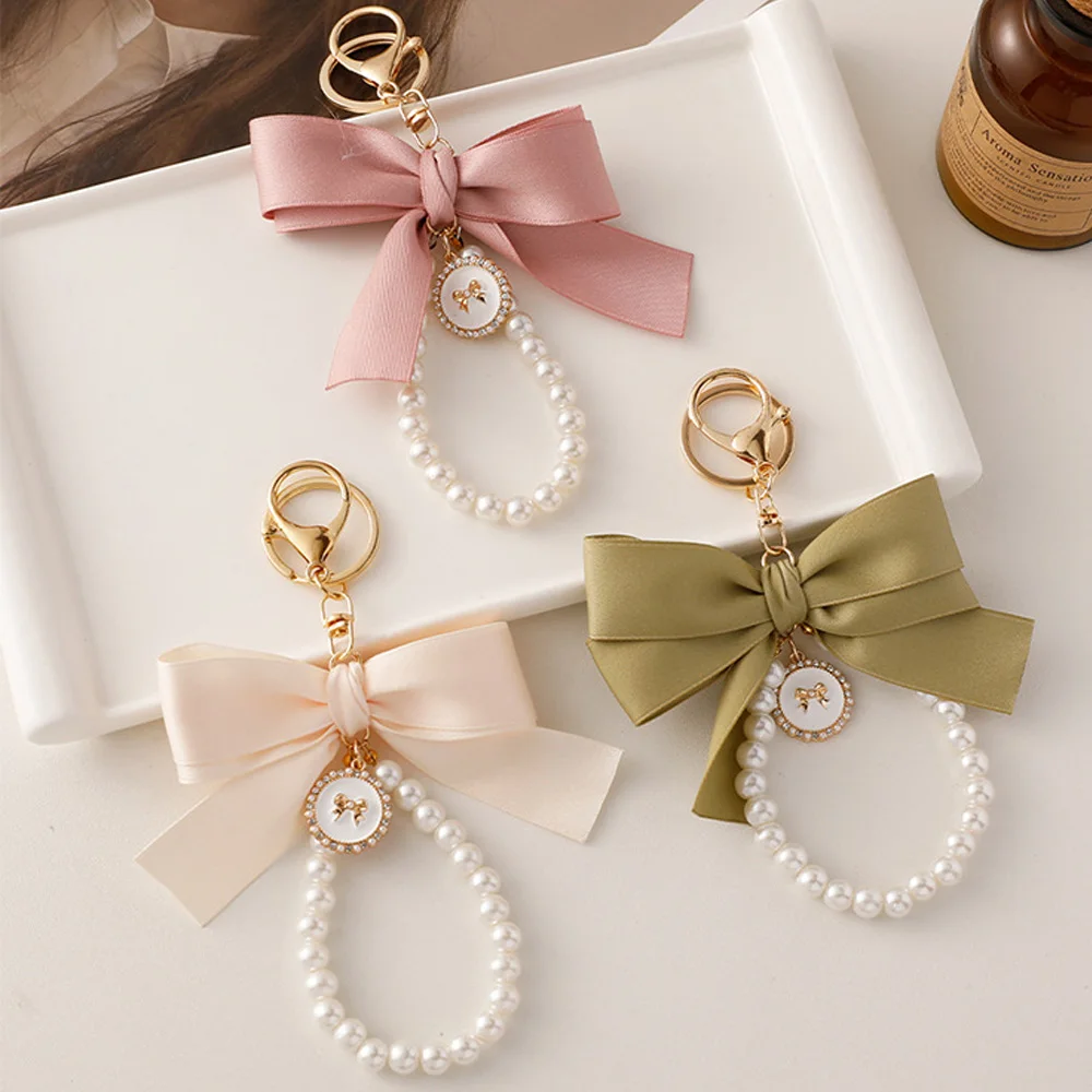 ?Fashion Big Bow Tie Key Chain Imitation Pearl Keyholder Metal Buckle Women Bag Charms Sweet Keychain Headphone Case Accessories