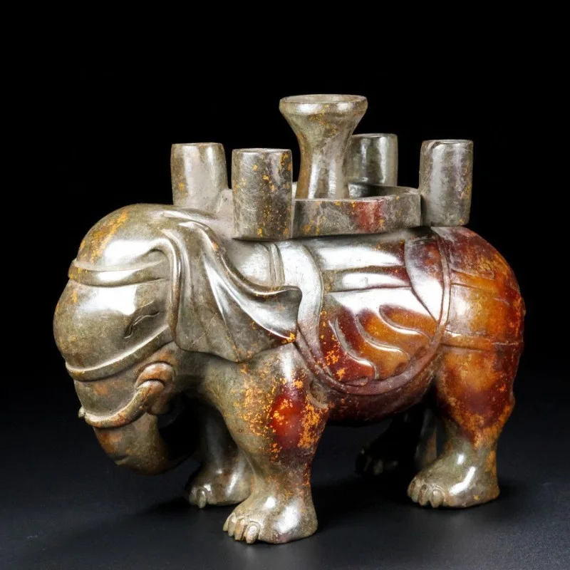 

The jade elephant weighs 2.55 kilograms, is 19.6 cm long, is 16.4 cm high, and is 8.4 cm thick.