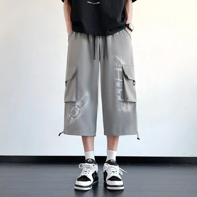 Pantaloni capri casual da uomo estivi streetwear 3/4 pantaloncini con coulisse sport all'aria aperta pantaloni corti larghi pantaloni in vita elastica per giovani