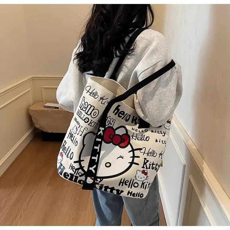 Personaje de Anime Hello Kitty bolso de mano de gran capacidad bolso de lona de moda bolso de hombro portátil Kawaii bolsa de almacenamiento de cosméticos