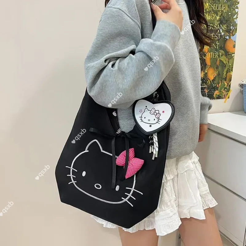 

Hello Kitty Black Shoulder Bag with Pink Bow, Stylish Tote Bag for Women, Cute Cat Face Design, Fashionable Daily Use Handbag