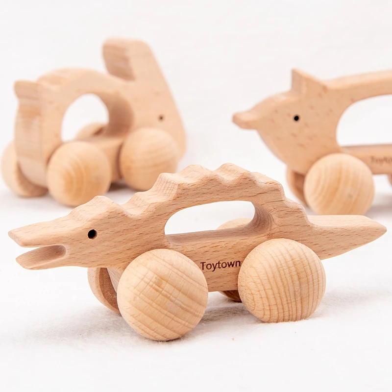 Set di giocattoli a spinta per animali in legno da nove pezzi con coccodrillo, coniglio e altri disegni di animali I bambini hanno esploderà spingendo il c