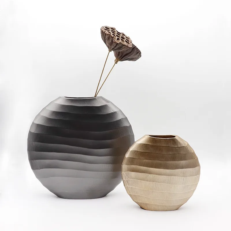 

Modern simple geometric golden resin egg-shaped vase, dried flower arrangement in the living room entrance