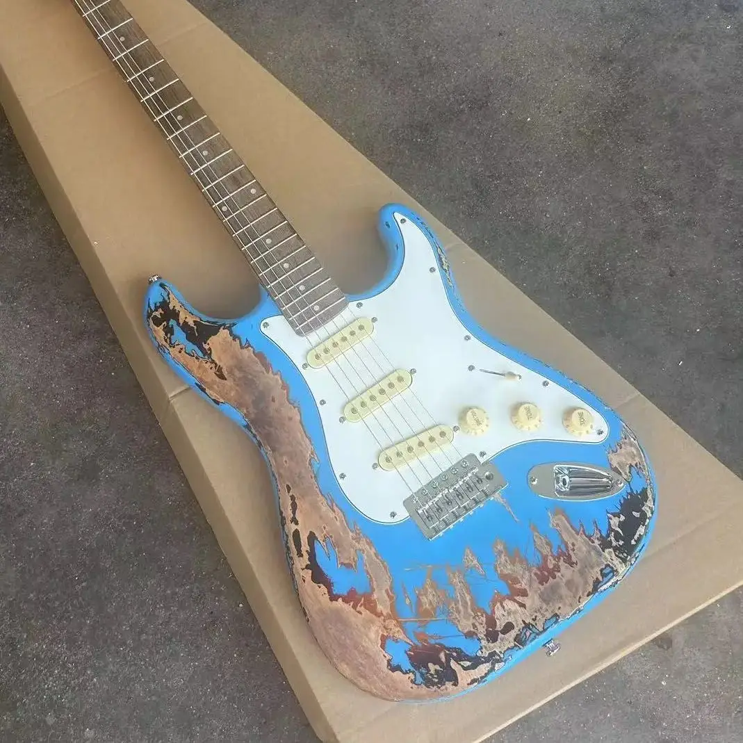 Blue six string electric guitar with distressed treatment, featuring a basswood body, maple neck, and white panel