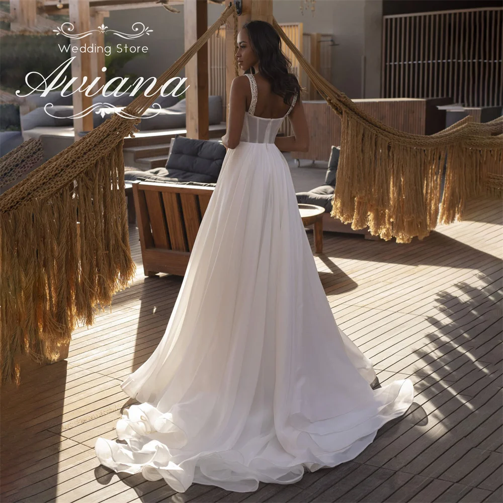 Aviana مخصص الحبيب الديكور إثارة ألف خط فستان الزفاف سويب تراين طول الأرض بلا أكمام الماس اللؤلؤ 2025