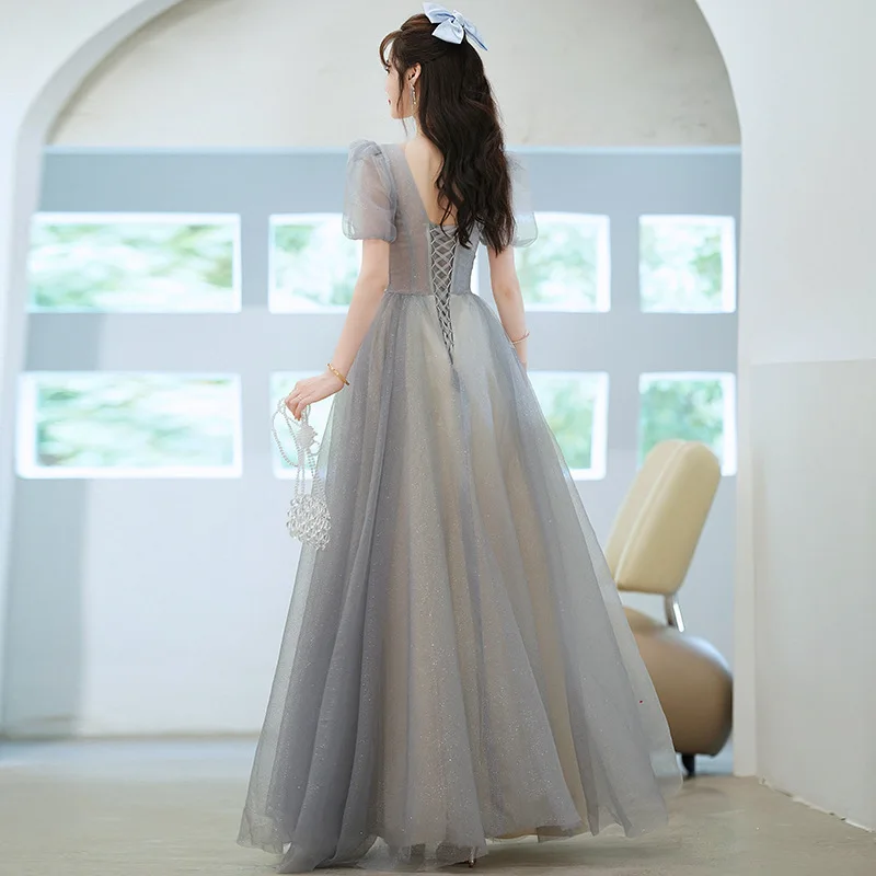 ชุดราตรีคอวีลึกสําหรับผู้หญิงฤดูร้อน 2025 ใหม่Elegant Princessชุดยาวอารมณ์โฮสต์การประชุมประจําปีชุด