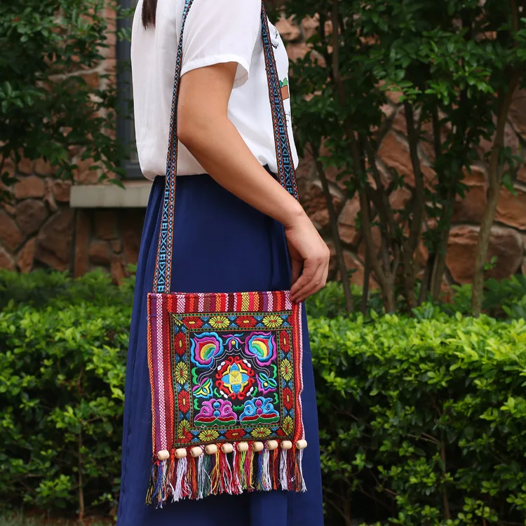 2023 new Yunnan ethnic style embroidery bag striped cloth embroidery single shoulder oblique span tassel camellia bag