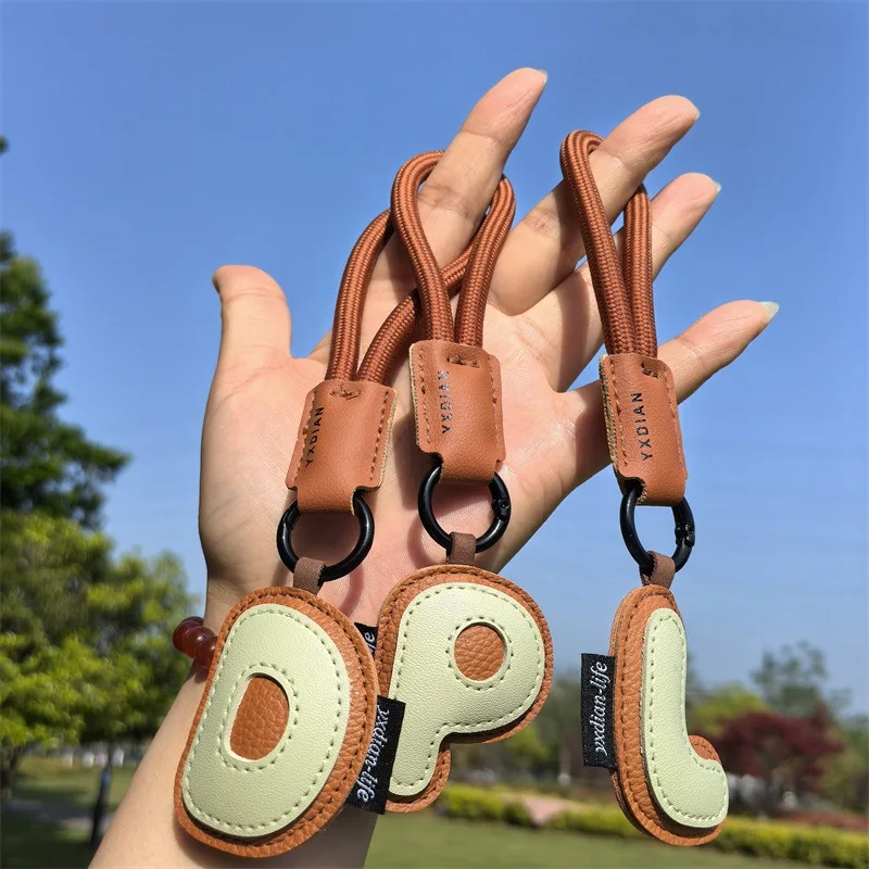 A To Z Leather Initials Keychain Braied Wristband Pendant Keyring for Women Men Car Bag Charms Camera Phone Case Accessories image 2