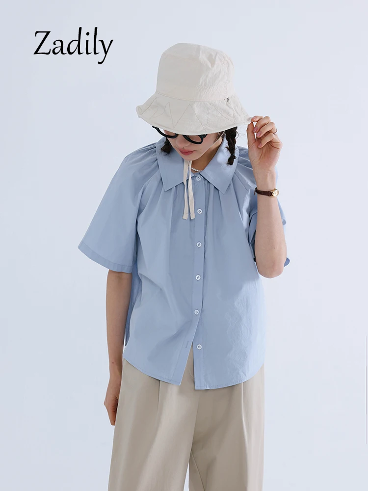 Zadily-Blusa de manga raglán corta para mujer, camisa blanca de algodón, estilo coreano, con pliegues y botones, para el trabajo, verano, 2023