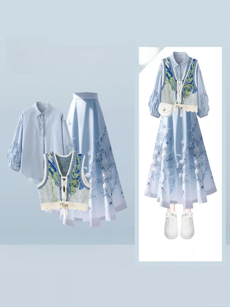 

Женский вязаный комплект из трех предметов: жилет, юбка и футболка. Нежный зимний модный наряд с цветочным узором, средней длины.