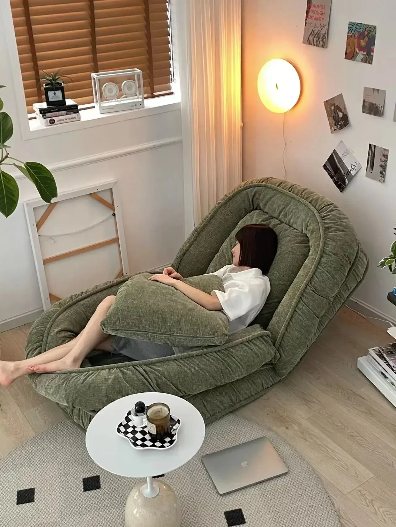 Human kennel lazy people can lie down and sleep. Small-sized living room with foldable single sofa bed.