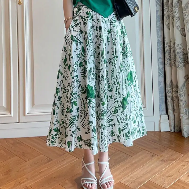Faldas por debajo de la rodilla con estampado elegante de verano para mujer, camisetas cortas verdes, conjunto de dos piezas, Tops plisados a la moda para señora nueva, trajes de falda