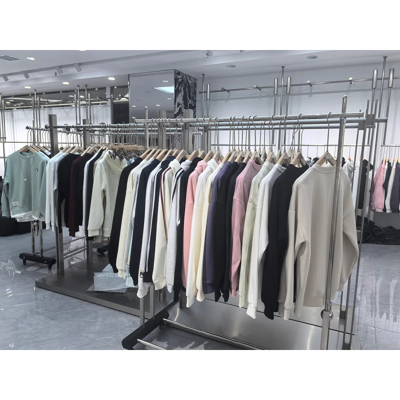 custom.Modern Man Clothing Custom Stainless Steel Wire Drawing Rack Garment Shop Display Furniture Store Design
