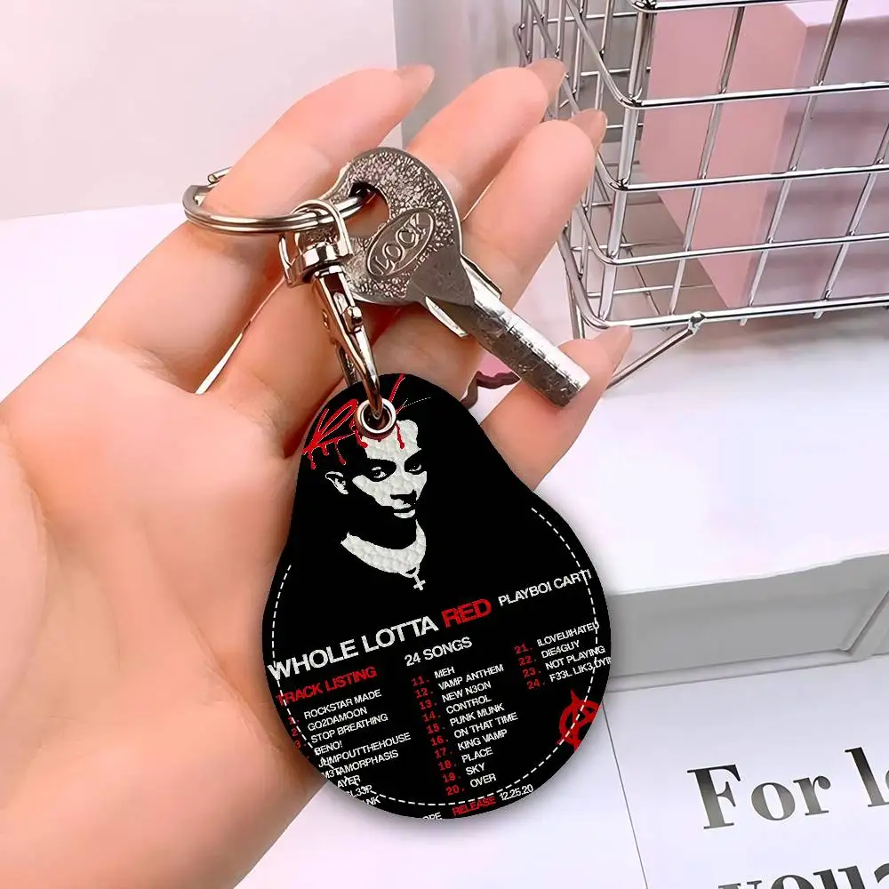 مغني الراب P-Playboi C-CartiS سلاسل المفاتيح المستديرة للنساء بولي Leather الجلود الفراغات حلقات المفاتيح مثالية لهدايا العيد ومفضلات الحفلات