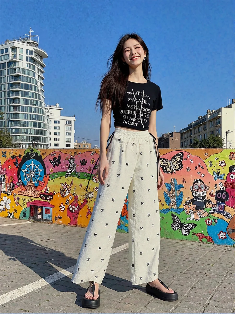 กางเกงขายาวทรงพาลาซโซผู้หญิงแบบผูกเชือก ทรงหลวม สไตล์ฤดูใบไม้ร่วง เอวสูง ทรงเข้ารูป ยืดหยุ่น เซ็กซี่ เหมาะสำหรับงานปาร์ตี้กลางคืน สีดำเงา