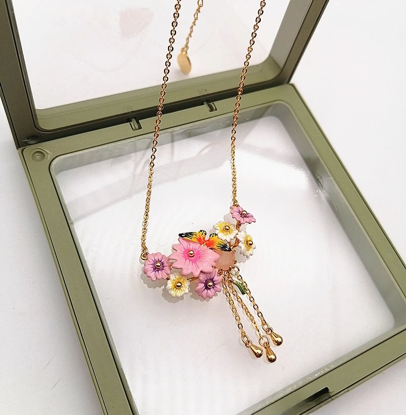 Colorful Parrot Flower Necklace for Women Enamel Bird Pendant with Pink Floral Details Whimsical Jewelry Gift Idea
