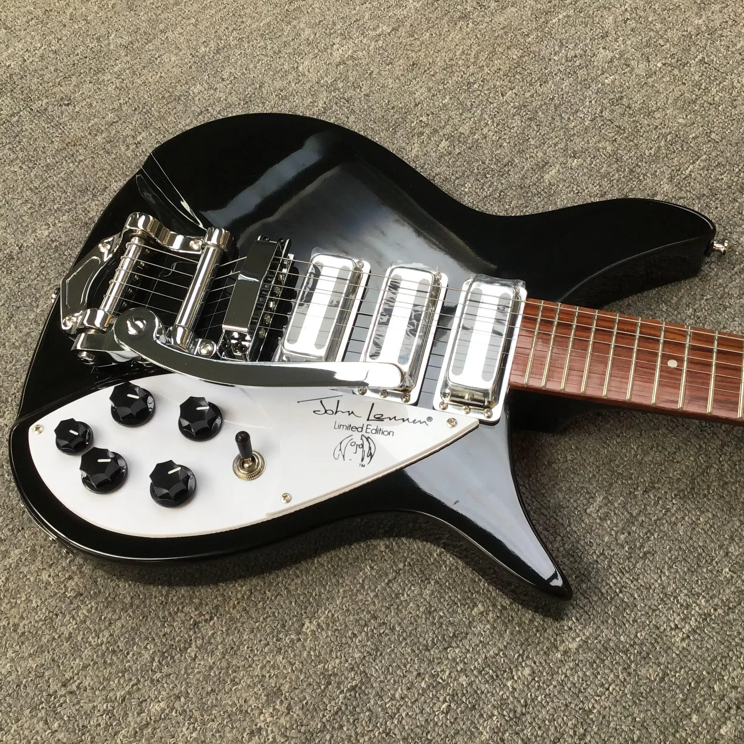 Gloss Black Retro Offset Guitar, SSS Pickups, Vintage Tremolo, Pearloid Pickguard, 6 Knobs, 21 Frets