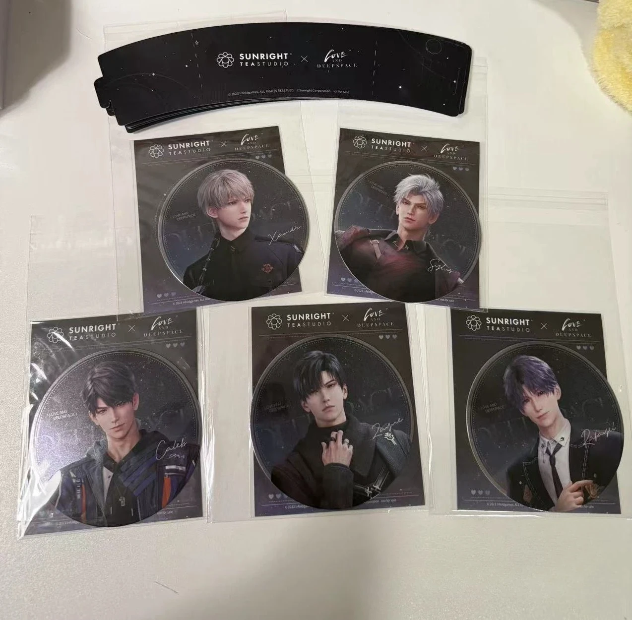 

In Stock Official Love and Deepspace X SUNRIGHT TEA STUDIO US Sylus Xavier Rafayel Caleb Zayne Cup Coaster Cup Cover Sticker