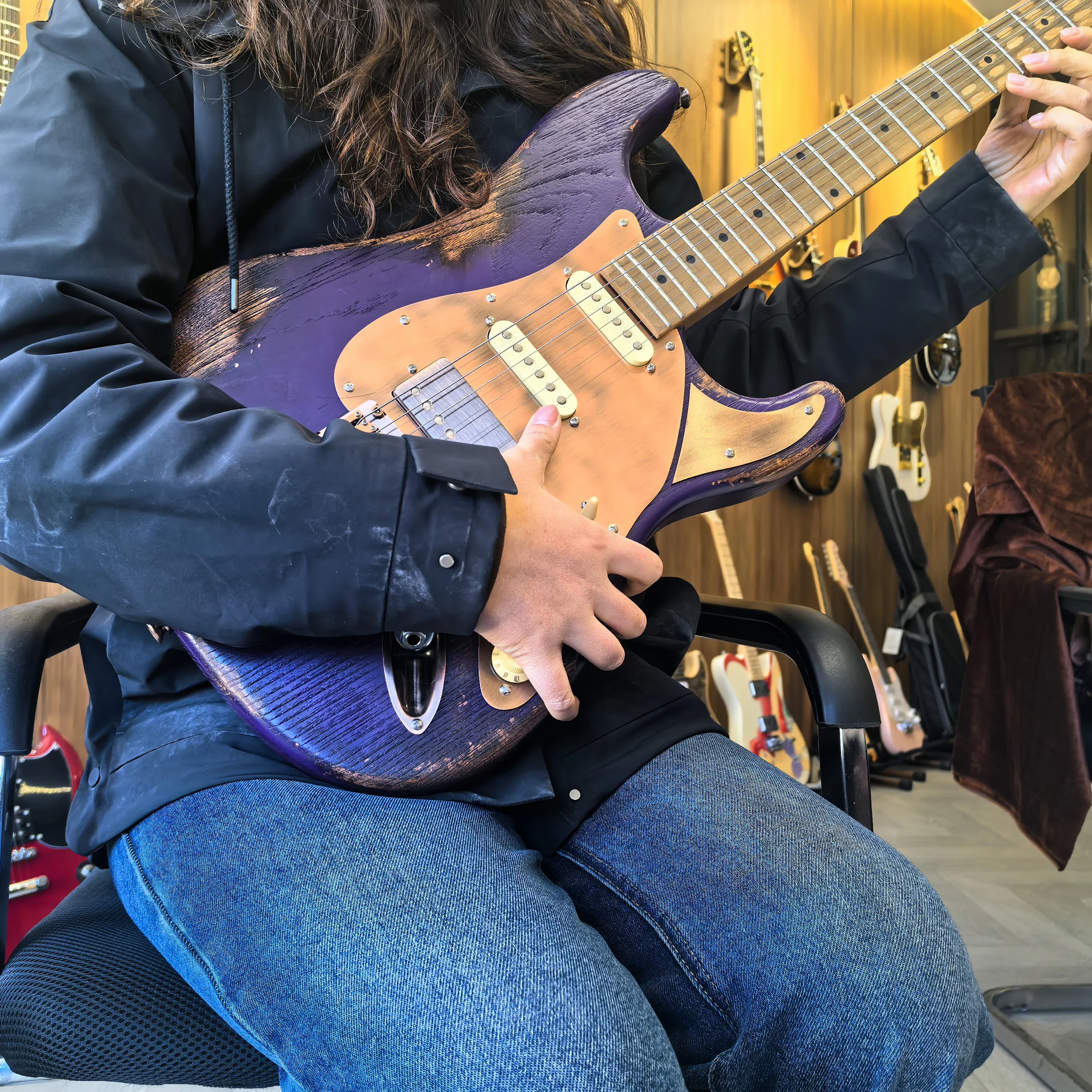 Make an old-style 6-string electric guitar. Purple color. Locking tuning pegs. Aluminum-nickel-cobalt pickups.  Customizable!