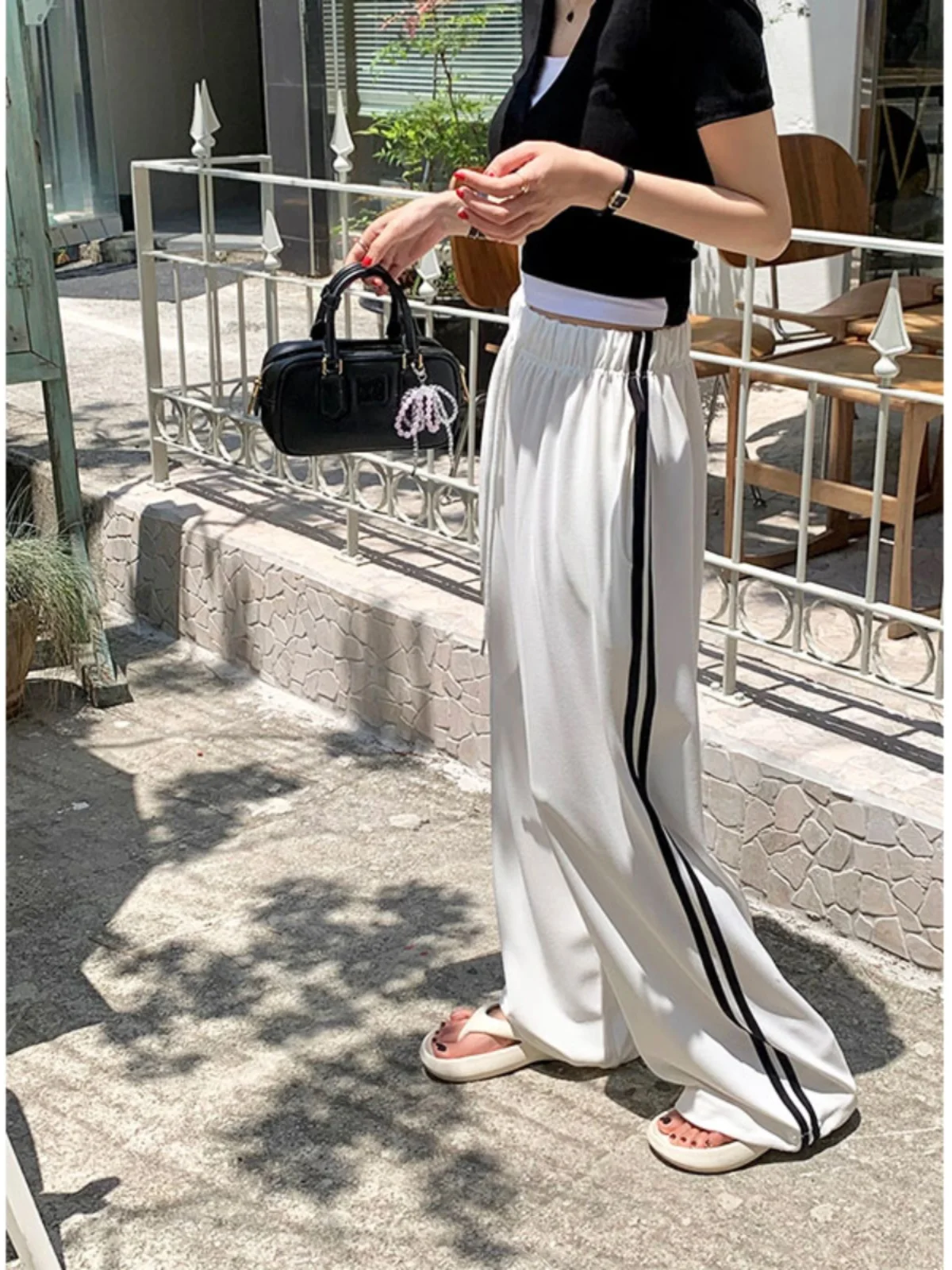 กางเกงขายาวลายทางลำลองสำหรับผู้หญิง เอวยางยืดแบบผูกเชือก ทรงหลวม ใส่สบาย ช่วยพรางหุ่น แฟชั่นทันสมัย