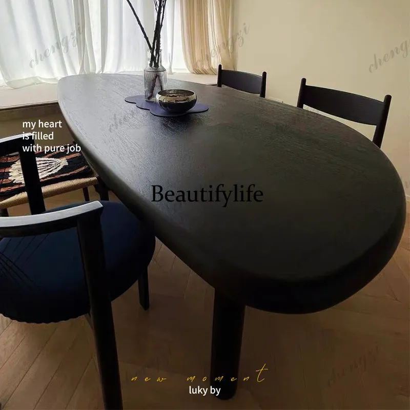 French modern simple solid wood oval mango dining table household small apartment black texture high-end log dining table