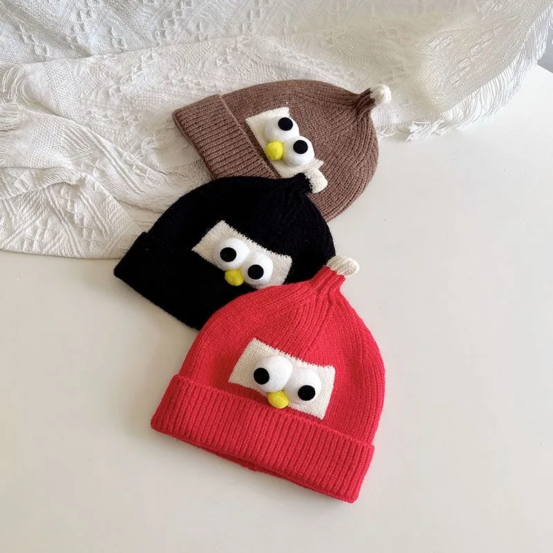 Baby hat fall and winter men and women Korean version of the baby knitted warm wool cap cute super cute eyes children\'s head cap