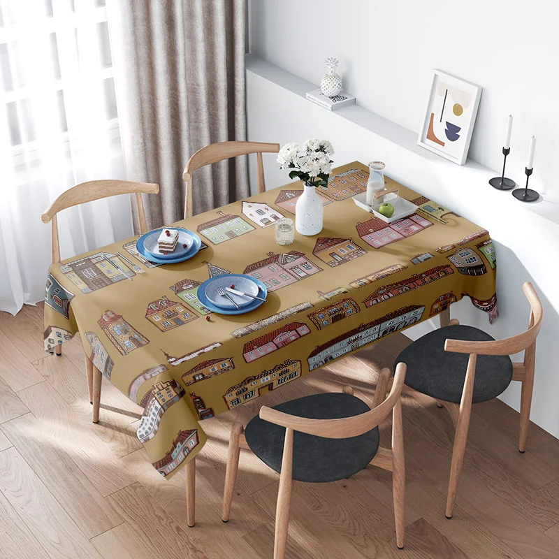 Decorate your dining table with this stylish city-themed printed tablecloth featuring charming buildings in warm colors perfect