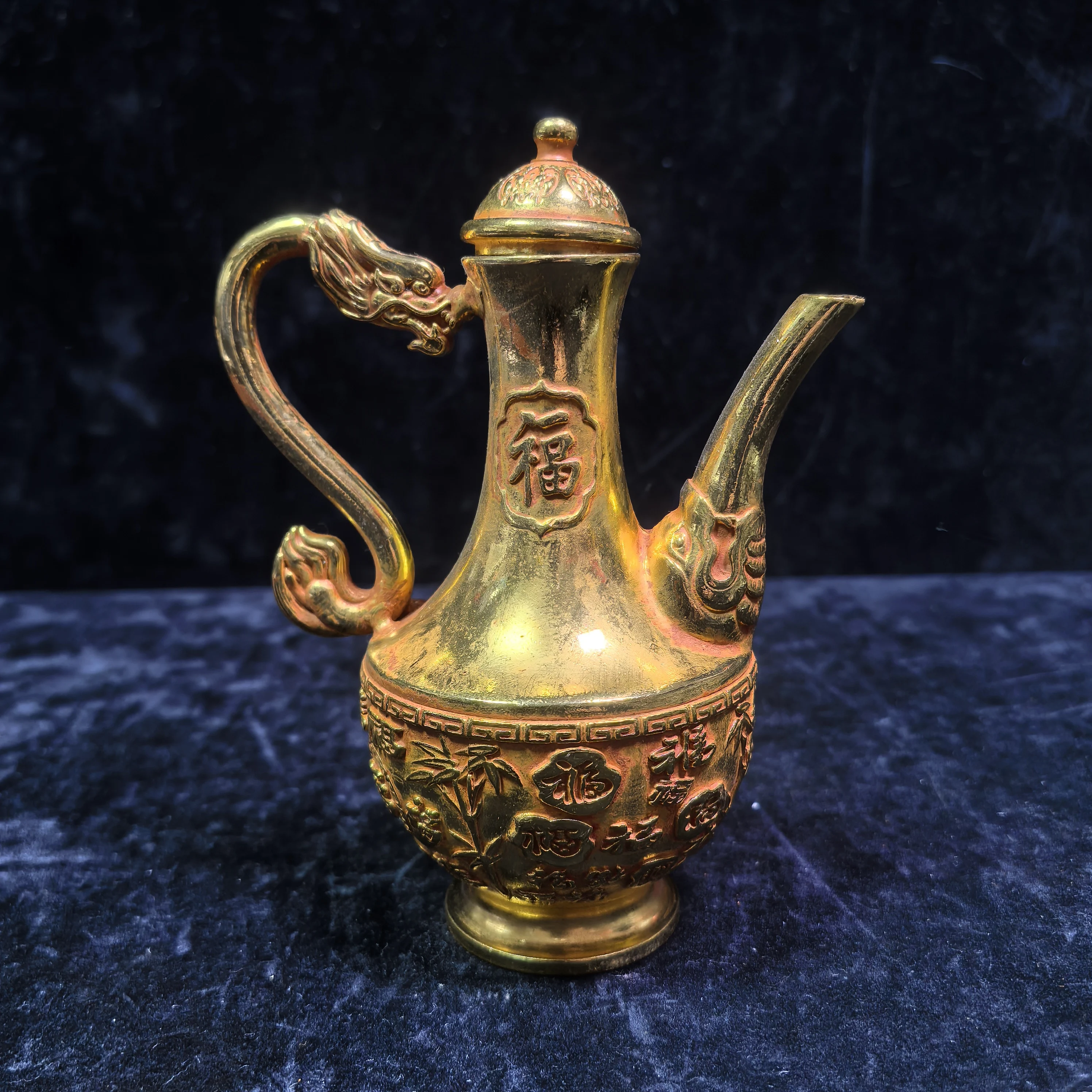 A gilded copper-carved 