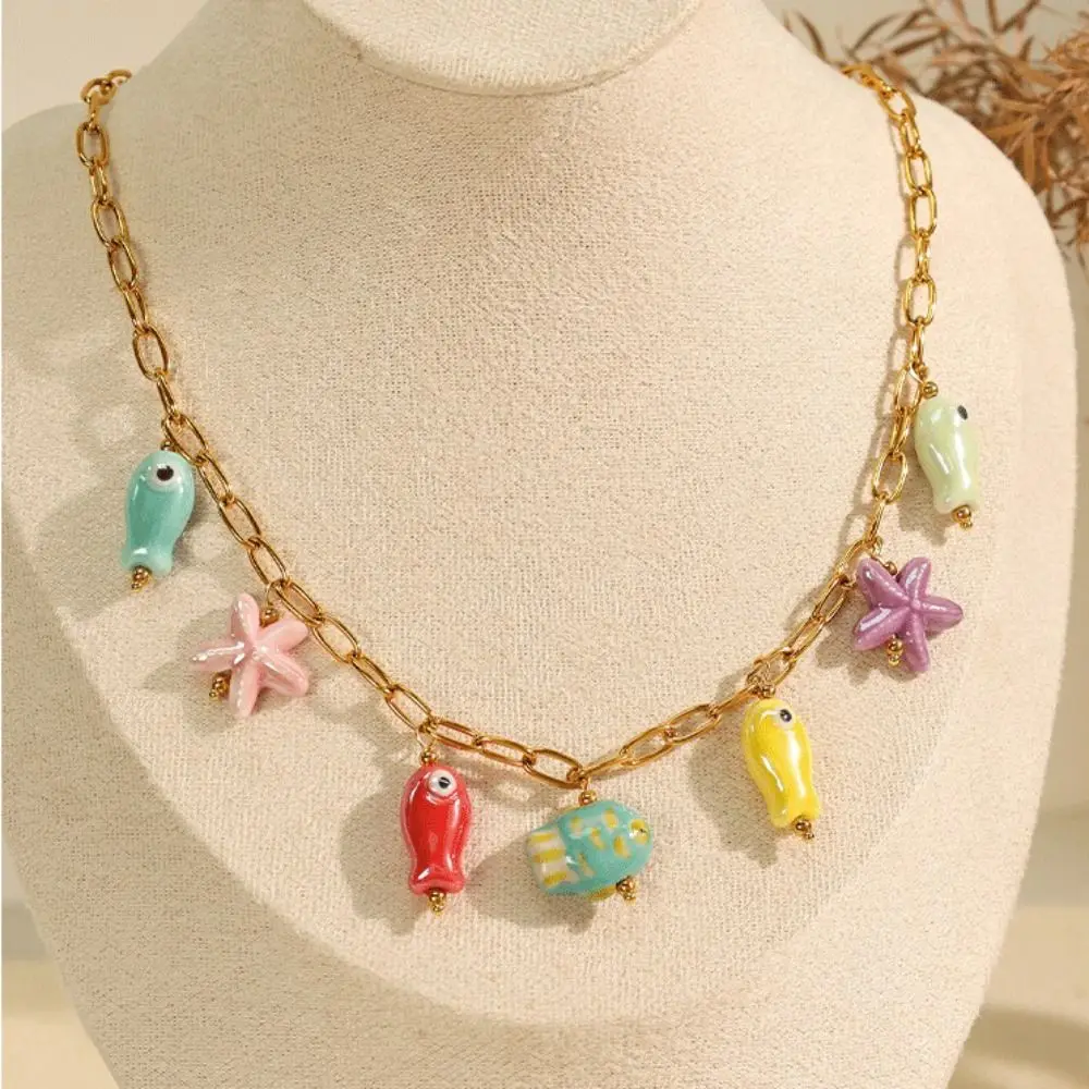 ไทเทเนียมเหล็กเซรามิคสร้อยคอปลาดาว Gold Vibrant Fish Drop สร้อยคอโซ่ปรับเสื่อมเสีย Ocean Theme สร้อยคอ