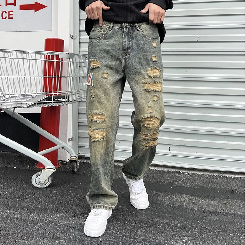 

Streetwear hole patches loose straight men's jeans fall and winter models American retro high street tide men's long pants