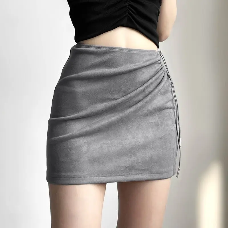 مثير التوابل فتاة تنورة من جانب واحد أضعاف سليم سليم تنورة مجوفة 2025 الربيع والصيف الفتيات نمط ملابس نسائية