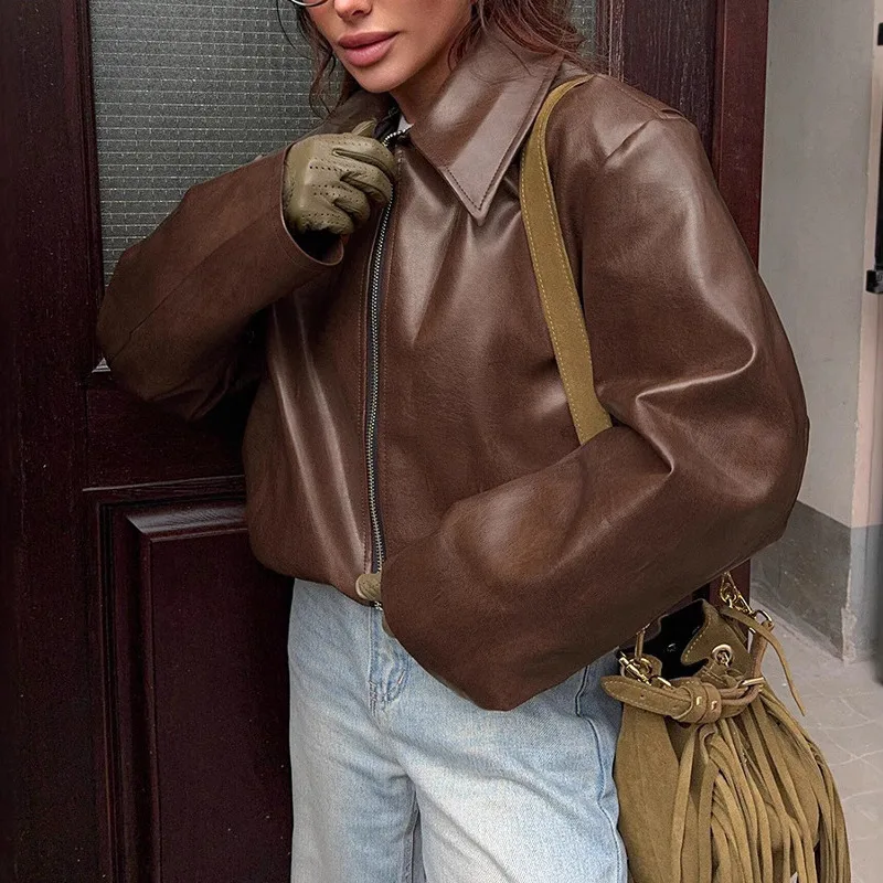 EAEOVNI الشارع الشهير سترة جلدية PU المرأة موضة بلون التلبيب سحاب أكمام طويلة معطف قصير موضة الخريف الشتاء جديد