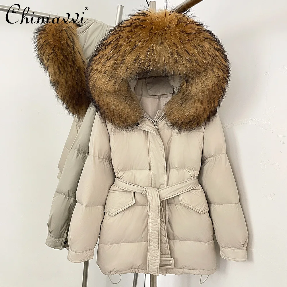 Stile coreano elegante collo di pelliccia di volpe di fascia alta con cappuccio giacche longuette inverno casual allentato spesso caldo cintura sottile piumini da donna