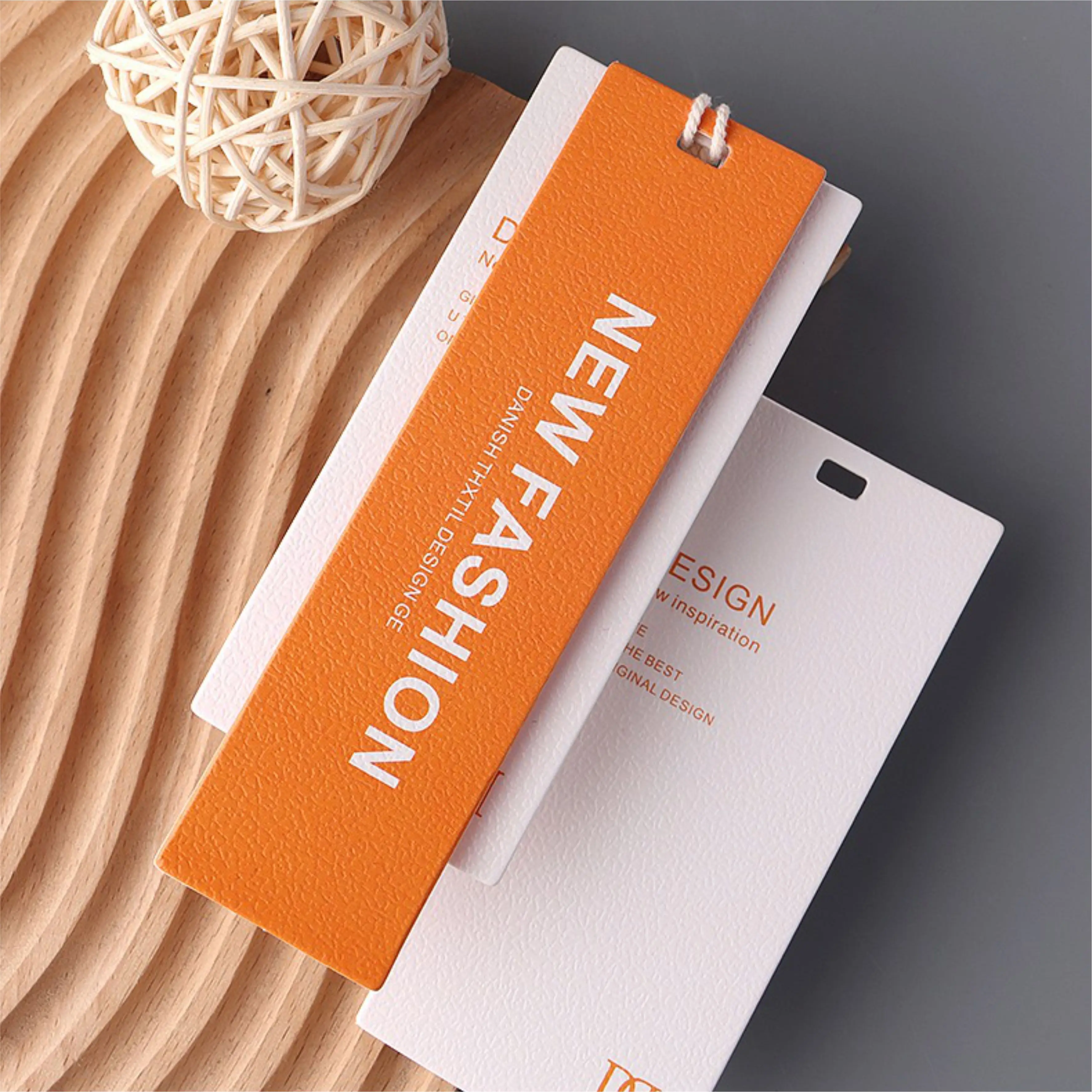 

Wholesale Thick High quality Eco friendly paper clothing labels Swing tags, can Custom Logo shape and color hang tags