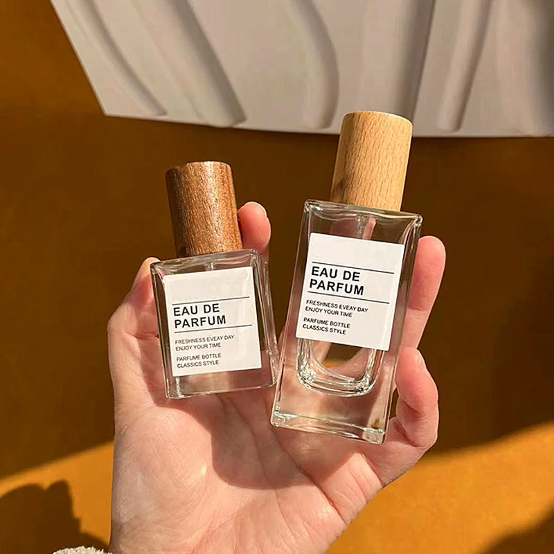 50/100 مللي زجاجات عطر زجاجية سميكة قابلة لإعادة الملء زجاجة رذاذ غطاء خشبي فارغة رذاذ خفيف زجاجات عطر محمولة للسفر