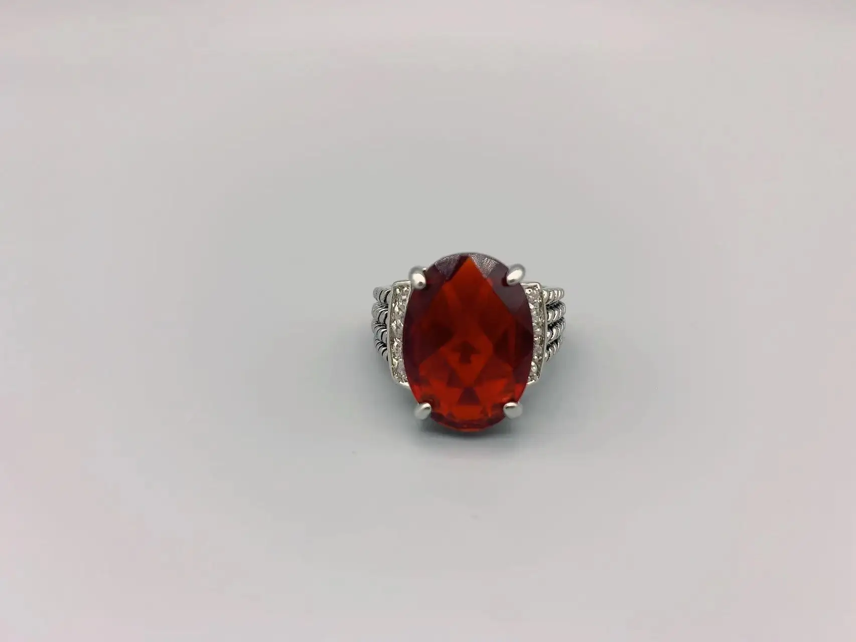 

Le Han Jewelry Tibetan Silver Cable Oval Red Stone Ring With Cubic Zirconia