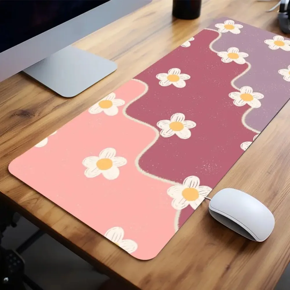 A mouse pad with a random pastel pattern of pink and purple flowers pc accessories desk organizers and trays tapis de souris