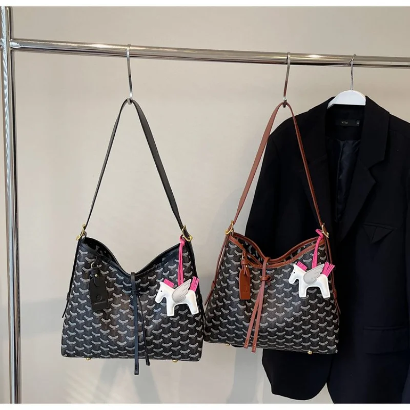 

Trendy Women Bag With Circular Shape And Top Handle Made From Hard Leather For Fashion Forward Statement