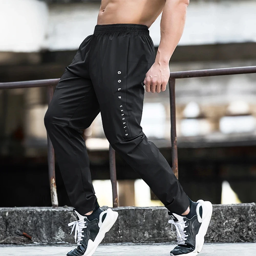 Letnie rozciągliwe spodnie do biegania nowe oddychające Casual Fitness spodnie do joggingu Outdoor do biegania duże spodnie męskie