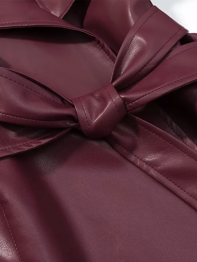 Nouvelle mode féminine de style européen : un manteau long en cuir polyvalent et élégant de couleur unie qui crée un effet minceur.