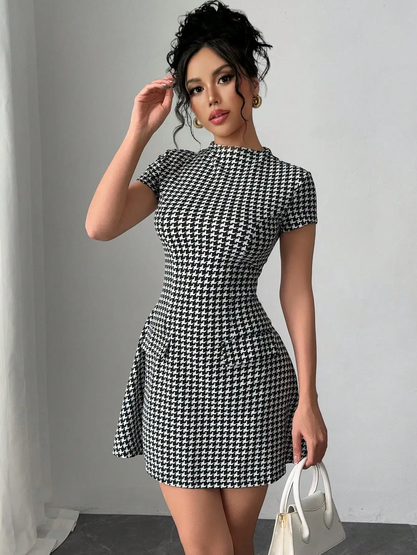 

Black and White Houndstooth Mini Dress with Short Sleeve and Fitted Waist
