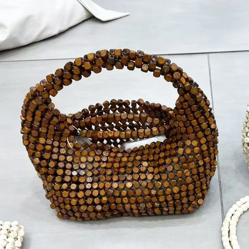 

Hand-Woven Hobos Beach Bags For Women Luxury Designer Handbag And Purses 2026 New In Wooden Beads Hollow Out Top Handle Shoulder