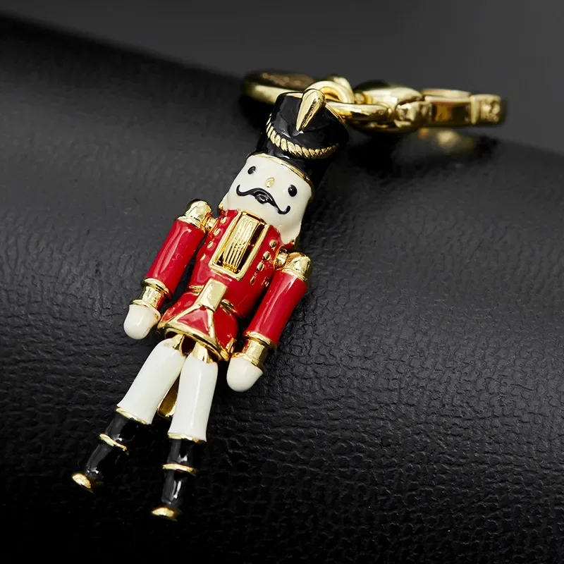 

Wholesale Enamel Color Glaze Soldier Pendant Niche Design Fashion Movable Robot Bag Pendant Pendant